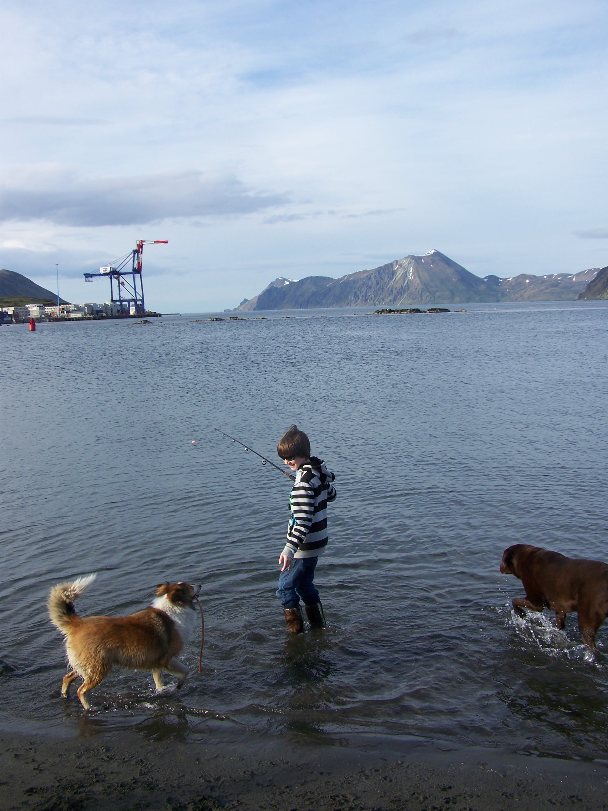 Boy Fishing with his dogs (Photo by Cathy Jordan)