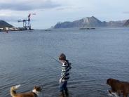 Boy Fishing with his dogs (Photo by Cathy Jordan)