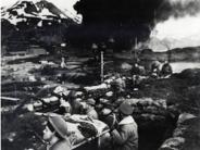 Marines entrenched during Japanese bombing, June 1942