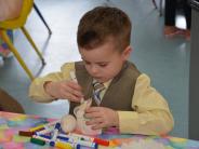 A child enjoying arts and crafts at the Easter Event