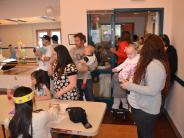 Families wait in line for their chance to take a photo with Peter Cotton Tail