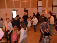 Fathers and their daughters enjoy a dance.