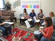 Drum Circle Class Practicing in Music Room 