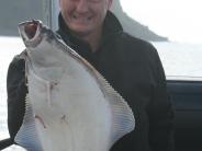Man with halibut catch