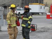 Volunteers  Takamichi Watanabe and Salvador Alvarado discuss response tactics