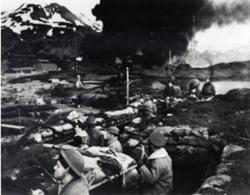 Marines entrenched during Japanese bombing of Unalaska/Dutch Harbor