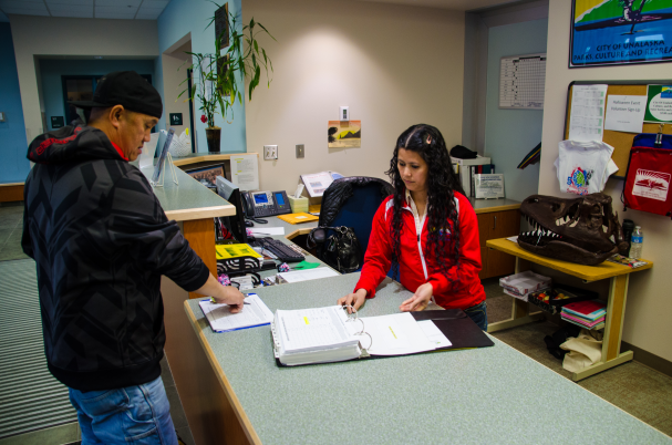 Recreation assistant assisting customer
