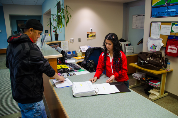 Recreation assistant assisting customer 