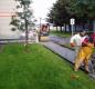 Facilities Maintenance staff working on the sidewalk